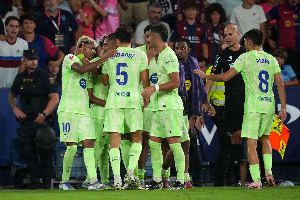VALENCIA, SPAIN - AUGUST 23: Players of FC Barcelona celebrate after Unai Elgezabel of Levante UD (not pictured) scored an own goal to make it the third goal for FC Barcelona during the LaLiga EA Sports match between Levante UD and FC Barcelona at Ciutat de Valencia on August 23, 2025 in Valencia, Spain. (Photo by Alex Caparros/Getty Images)