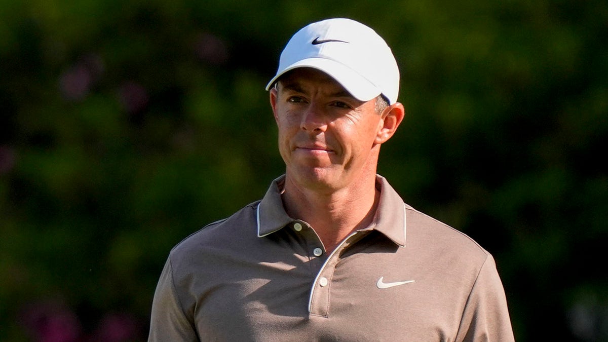 Rory McIlroy looks on course