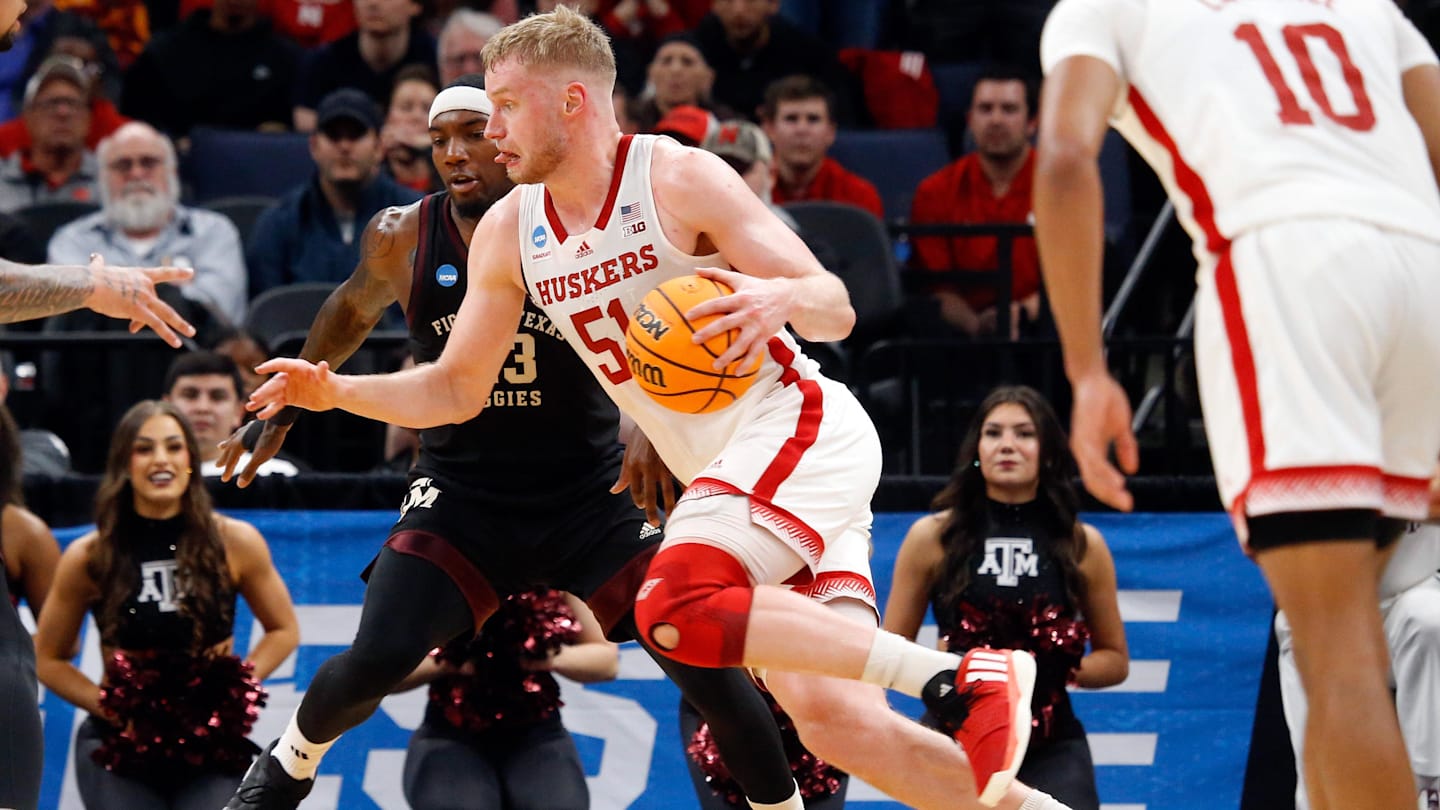 Mar 22, 2024; Memphis, TN, USA; Nebraska Cornhuskers forward Rienk Mast (51) drives to the basket as Texas A&M Aggies guard Tyrece Radford (23) defends during the first half in the NCAA Tournament First Round at FedExForum. Mandatory Credit: Petre Thomas-Imagn Images