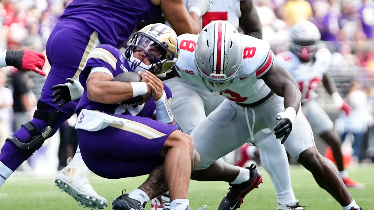 Ohio State Buckeyes linebacker Arvell Reese (8) tackles Washington Huskies quarterback Demond Williams Jr. (2) during the first half of the NCAA football game at Husky Stadium in Seattle on Sept. 27, 2025.
