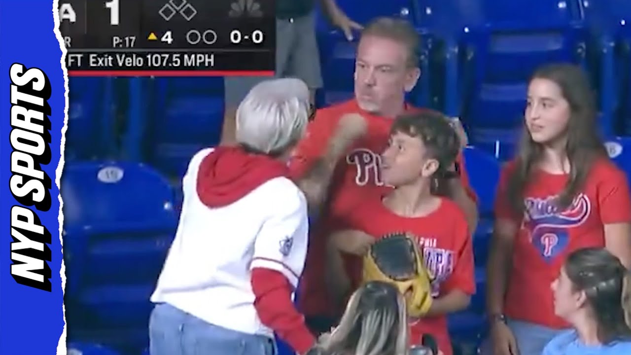 Woman BERATES father and son over home run ball