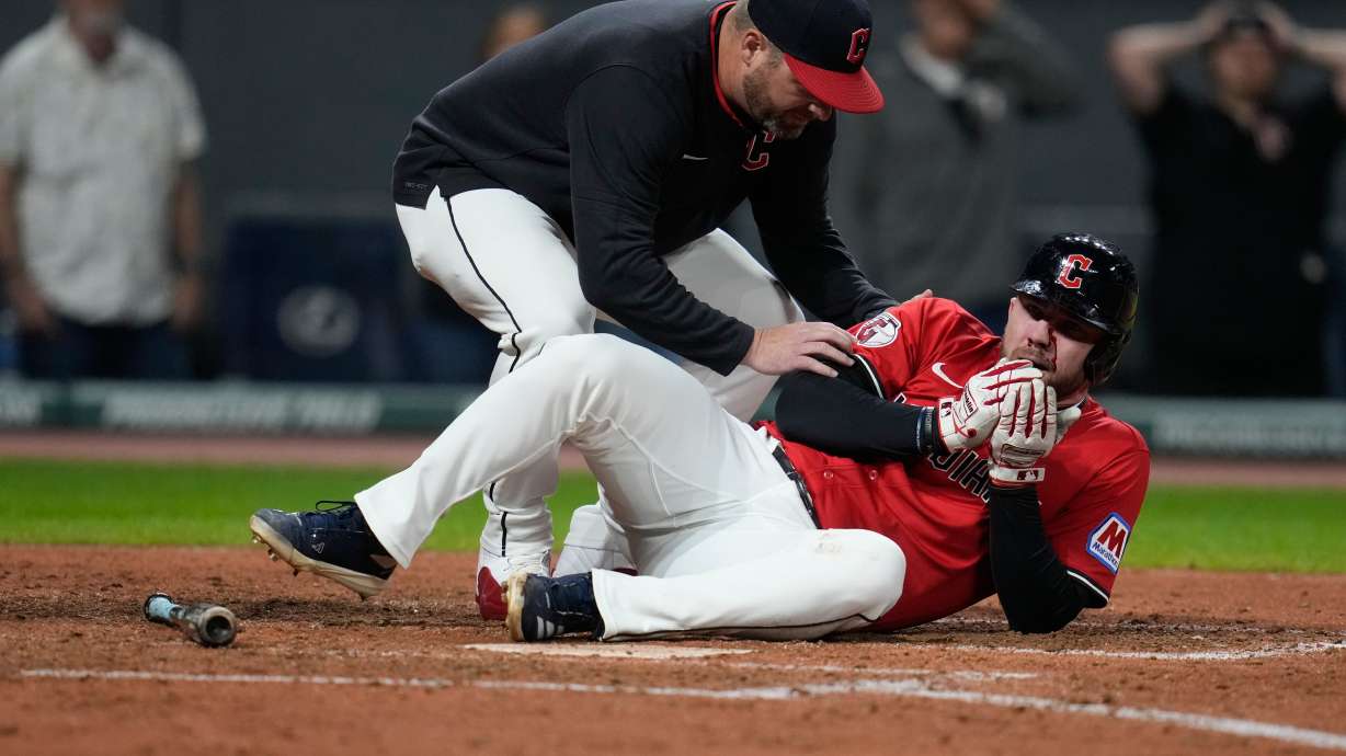 Guardians' David Fry carted off field after being hit in face by pitch while trying to bunt