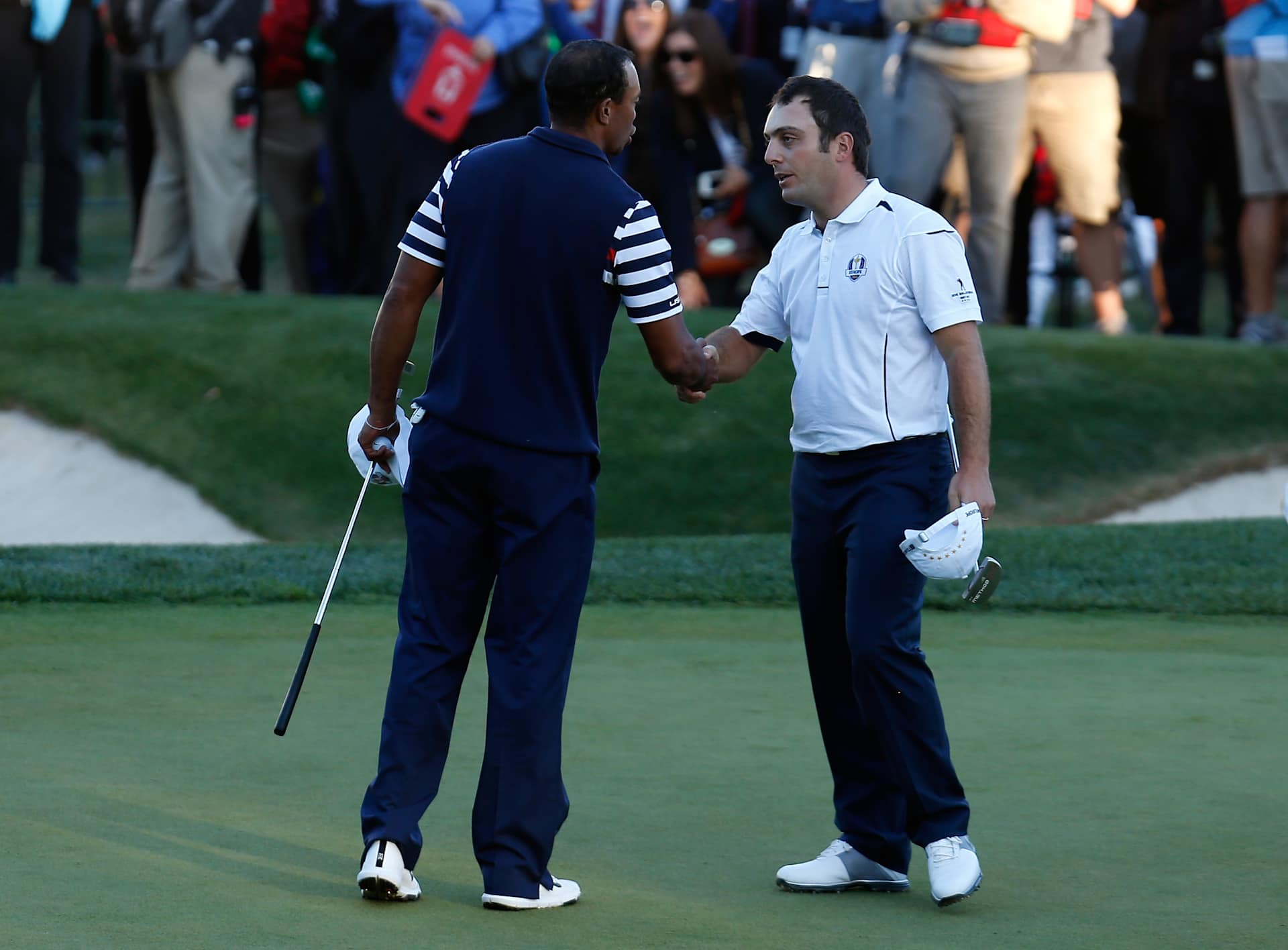 MEDINAH, IL - SEPTEMBER 30:  Francesco Molinari of Europe (R) shakes hands with Tiger Woods of the USA on the 18th green after halving his match with Woods during the Singles Matches for The 39th Ryder Cup at Medinah Country Club on September 30, 2012 in Medinah, Illinois.  (Photo by Jamie Squire/Getty Images)
