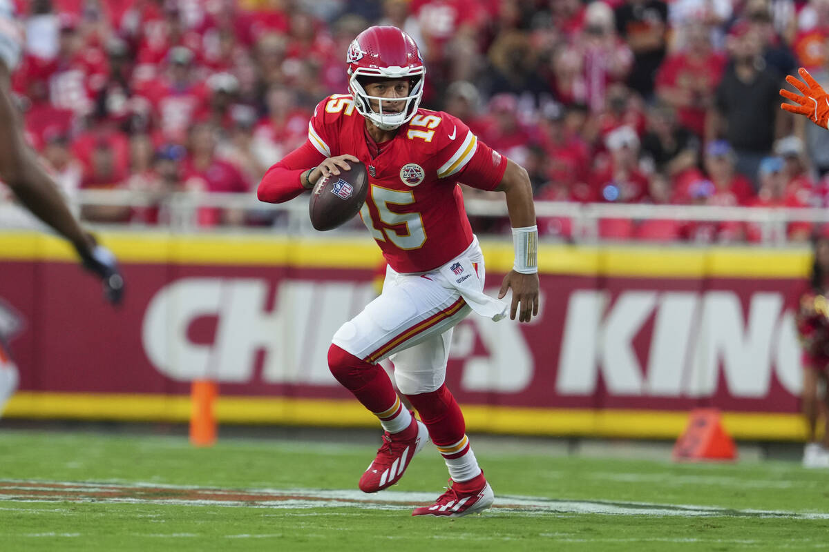 Kansas City Chiefs quarterback Patrick Mahomes looks to pass during the first half of an NFL pr ...