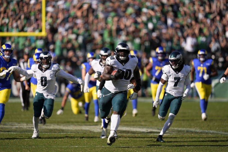 Philadelphia Eagles defensive tackle Jordan Davis runs the ball back for a touchdown