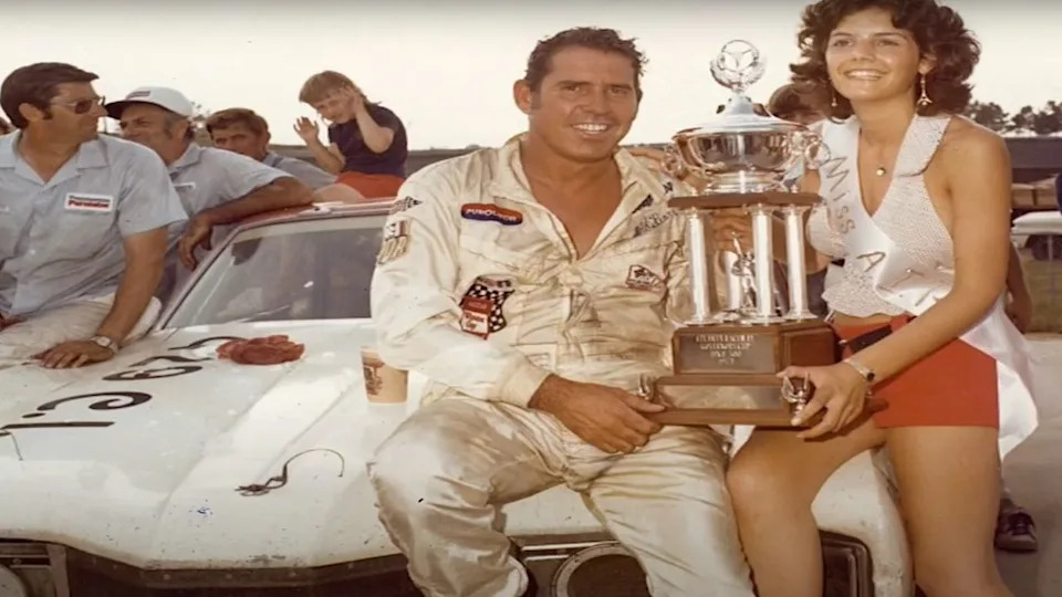 David Pearson holding trophy