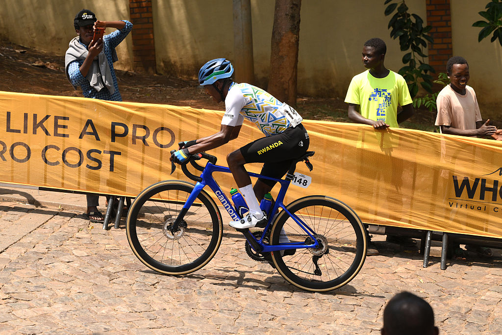 KIGALI, RWANDA - SEPTEMBER 28: Eric Manizabayo and Team Rwanda competes during the 98th UCI Cycling World Championships Kigali 2025, Men Elite Road Race a 267.5km race from Kigali to Kigali on September 28, 2025 in Kigali, Rwanda. (Photo by David Ramos/Getty Images)