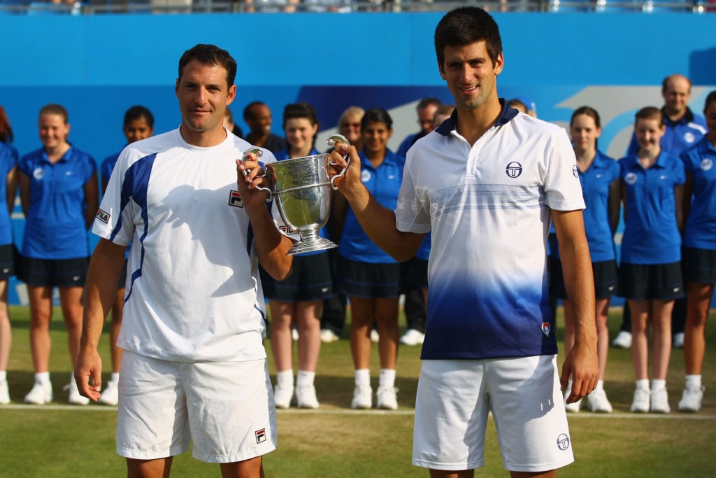 Novak Djokovic and Jonathan Erlich celebrate with the 2010 Queen's title