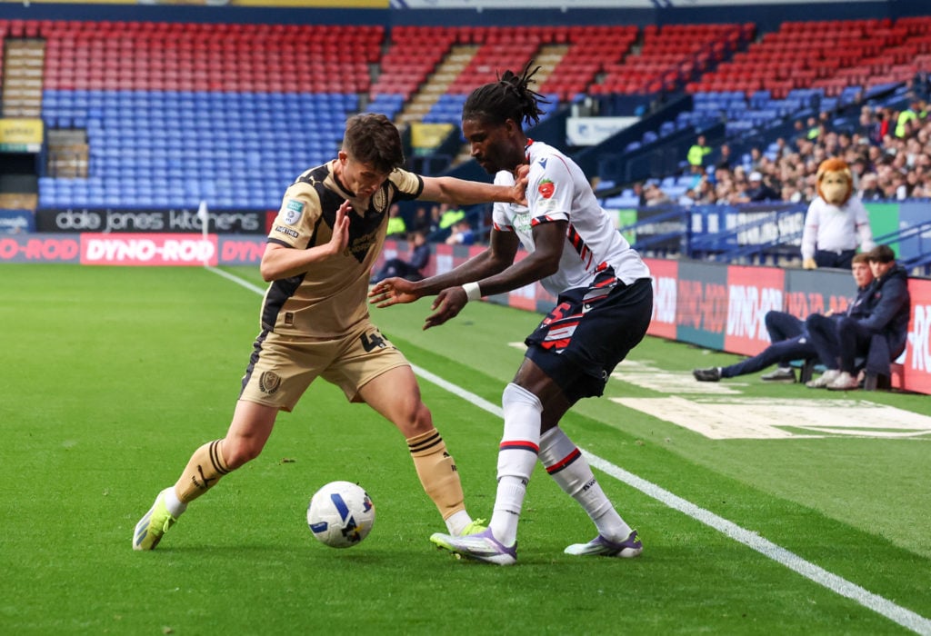 Rotherham United's Daniel Gore battles with Bolton Wanderers' Richard Taylor