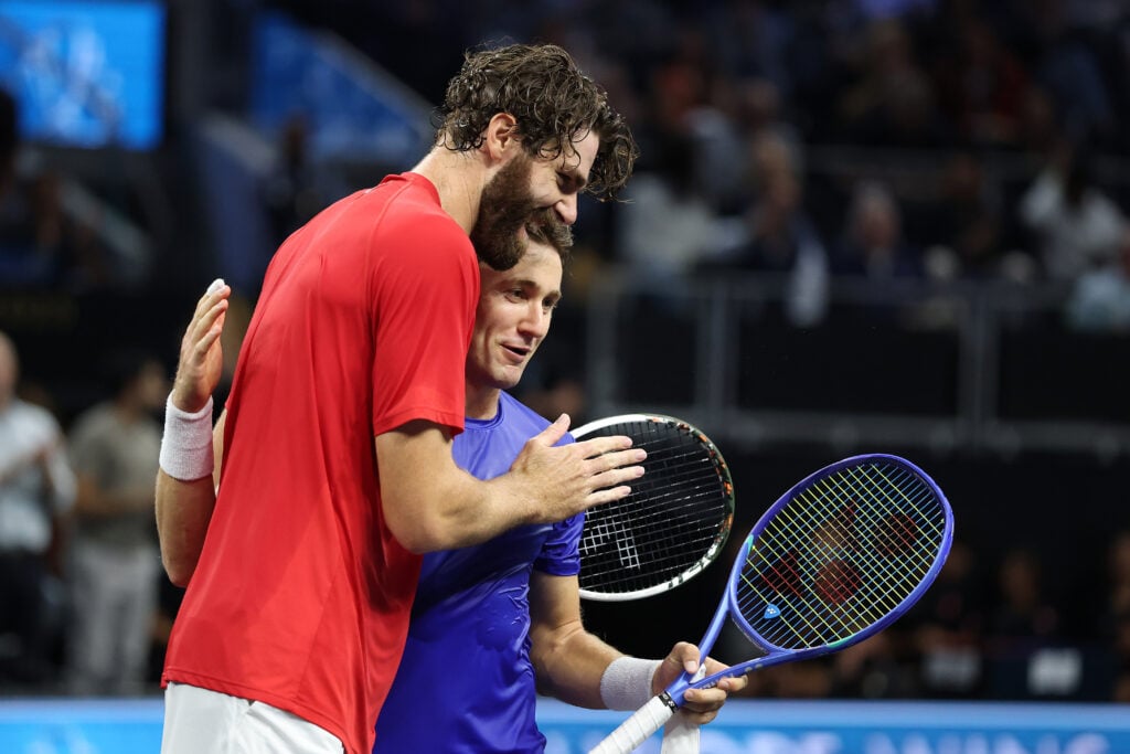 Reilly Opelka and Casper Ruud meet at the net after their clash on day one of the 2025 Laver Cup.