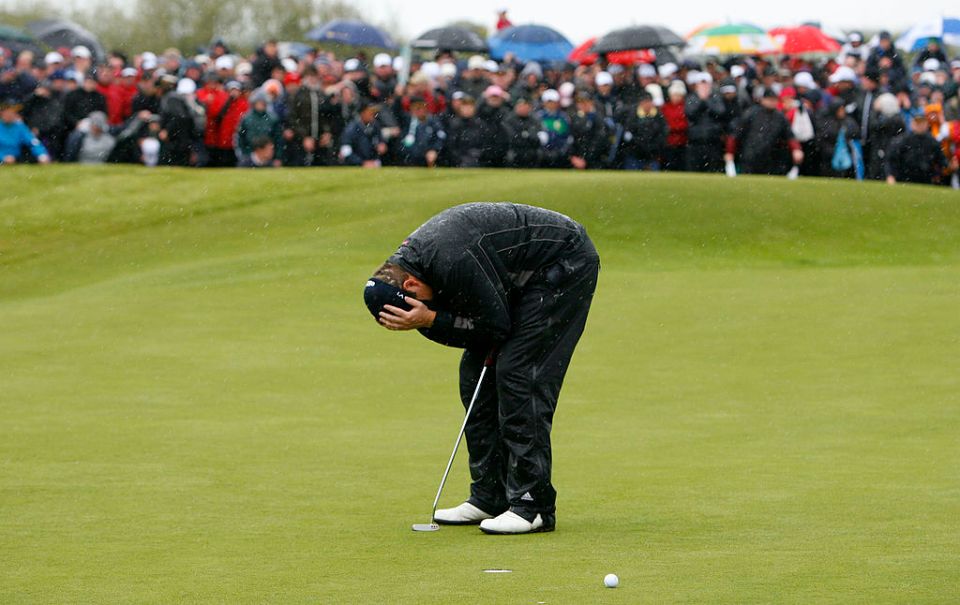 Irish amateur Shane Lowry reacts after missing a putt on the 18th green during the final round of the Irish Open at Baltray in County Louth, Ireland on May 17, 2009. Lowry played three playoff rounds to against England's Robert Rock to win the Irish Open. AFP PHOTO/c (Photo credit should read PETER MUHLY/AFP via Getty Images)