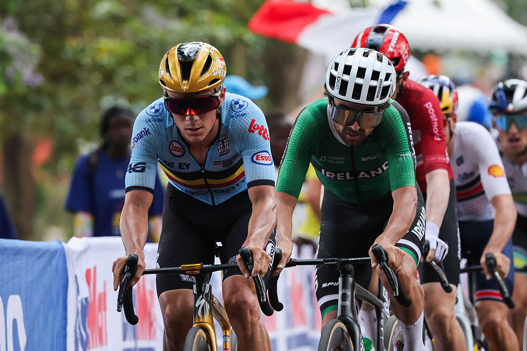 Belgian rider Remco Evenepoel (L) and Irish rider Ben Healy ride on cobbles in the men's Elite road race cycling event during the UCI 2025 Road World Championships, in Kigali, on September 28, 2025. (Photo by Anne-Christine POUJOULAT / AFP)