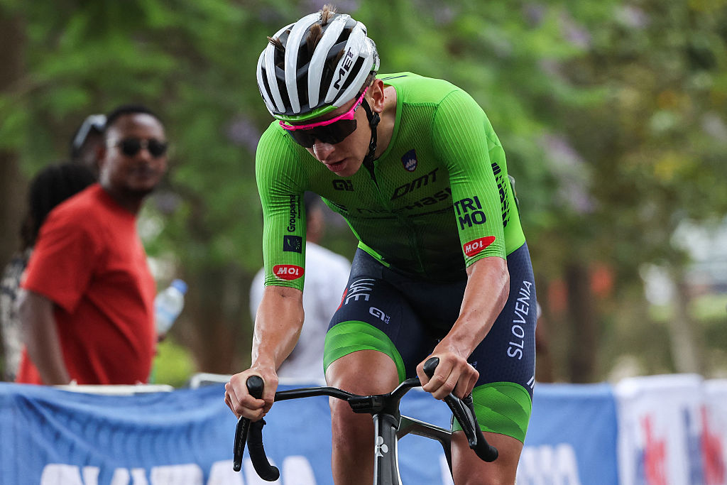 Slovenian rider Tadej Pogacar rides on cobbles as he leads the men's Elite road race cycling event during the UCI 2025 Road World Championships, in Kigali, on September 28, 2025. (Photo by Anne-Christine POUJOULAT / AFP)