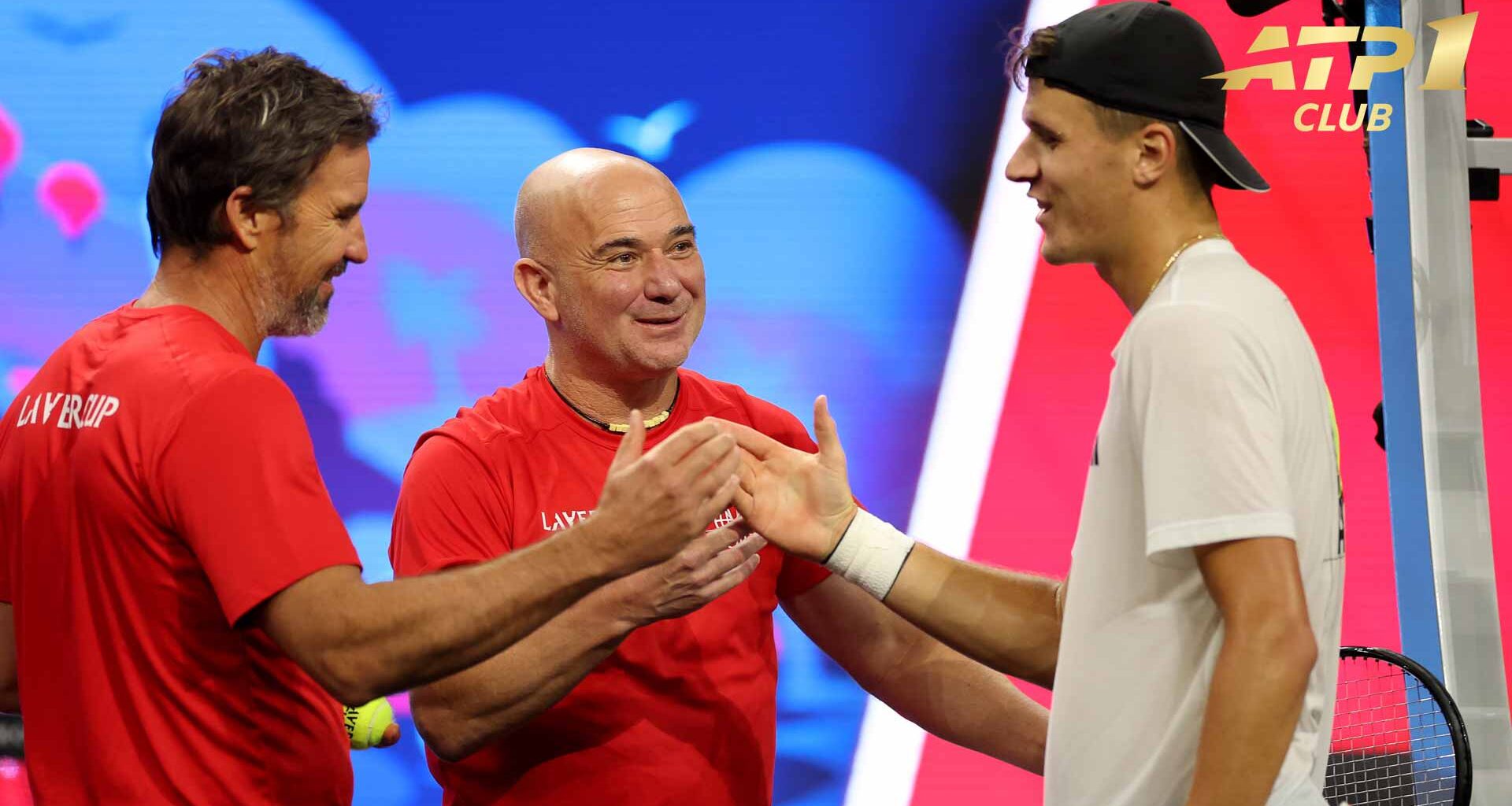 Team World captain Andre Agassi (middle) and vice captain Patrick Rafter (left) greet Jakub Mensik.