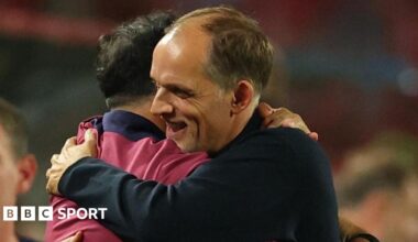 England head coach Thomas Tuchel is embraced by a member of his backroom team after the 5-0 win against Serbia in Belgrade