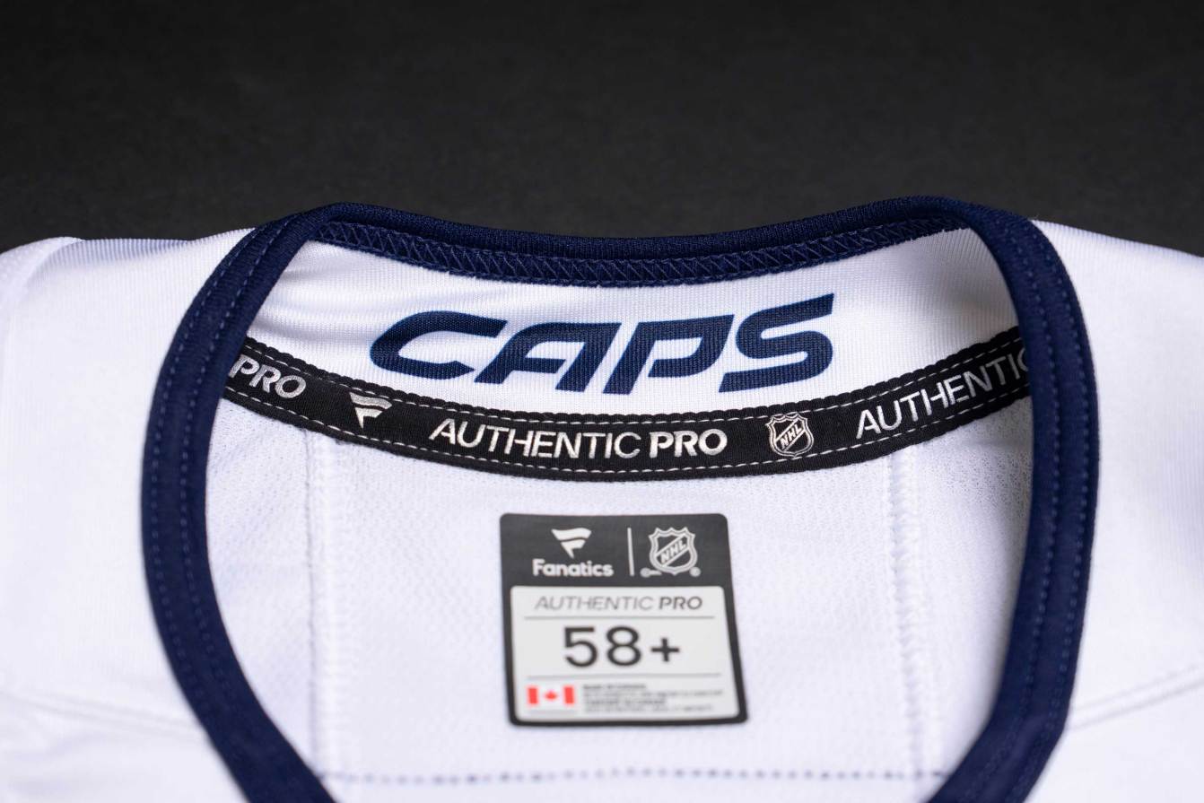 CAPS wordmark on the back neck of the team's third jerseys