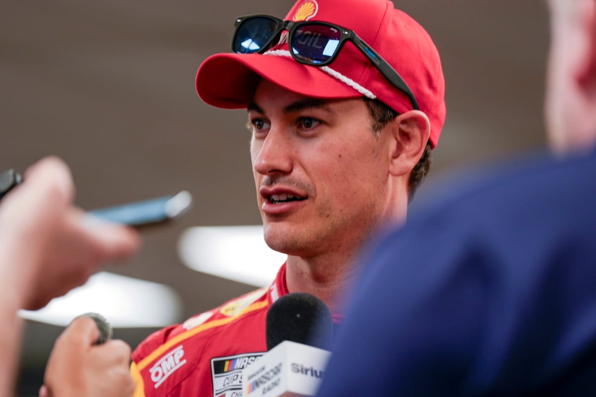 An image of NASCAR driver Joey Logano talking to the media