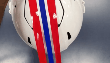 I love these videos of football equipment managers applying helmet decals by hand with perfect precision