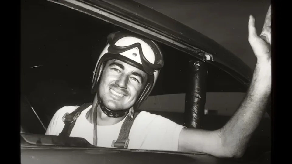 young Bobby Allison with racing helmet