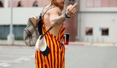 George Kittle paying up for his lost bet to Brock Purdy.