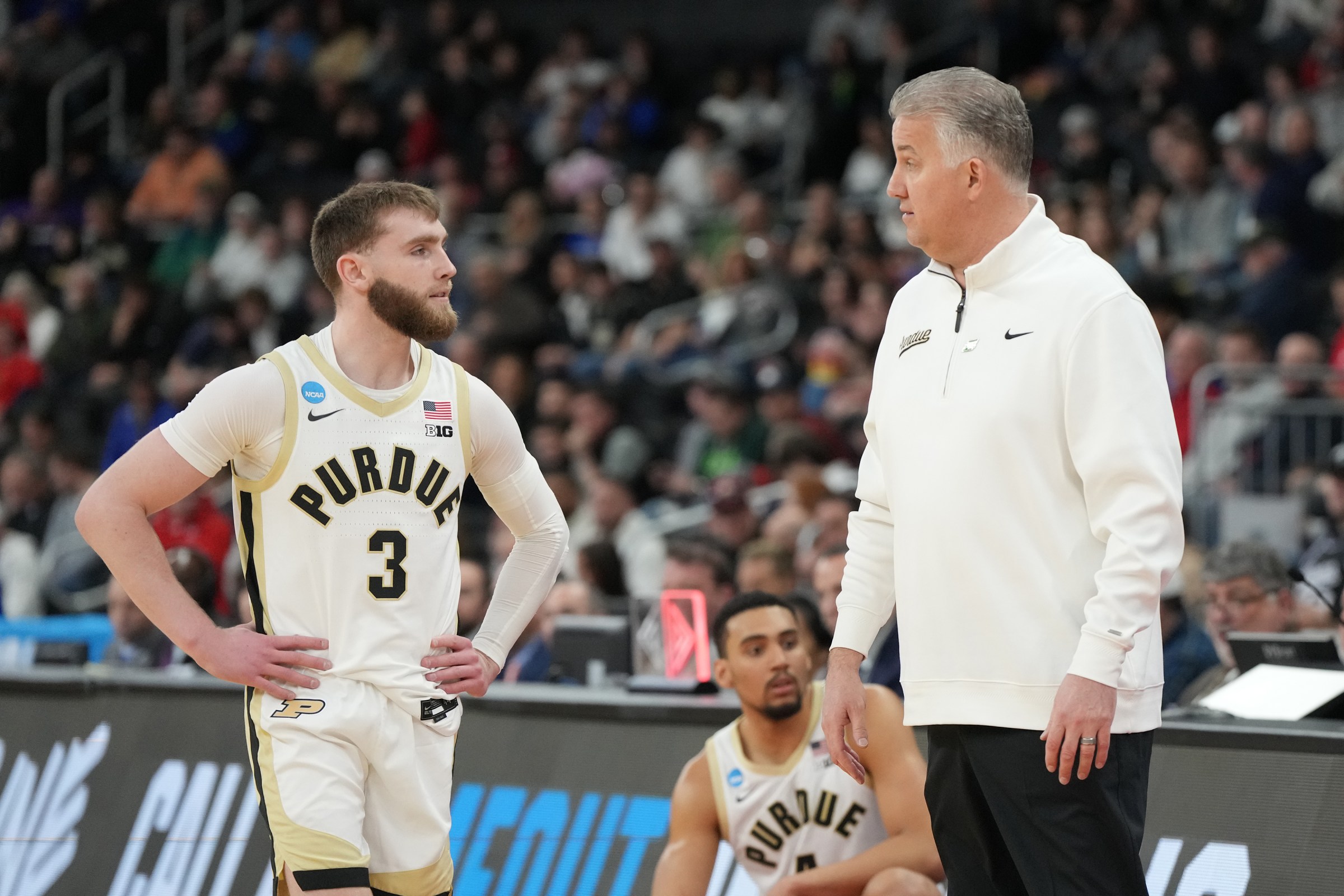 PROVIDENCE, RHODE ISLAND - MARCH 22: Braden Smith #3 of the Purdue Boilermakers talks with head coach Matt painter during a second round game against the McNeese State Cowboys in the NCAA Men’s Basketball Tournament at Amica Mutual Pavillion on March 22, 2025 in Providence, Rhode Island. (Photo by Mitchell Layton/Getty Images)