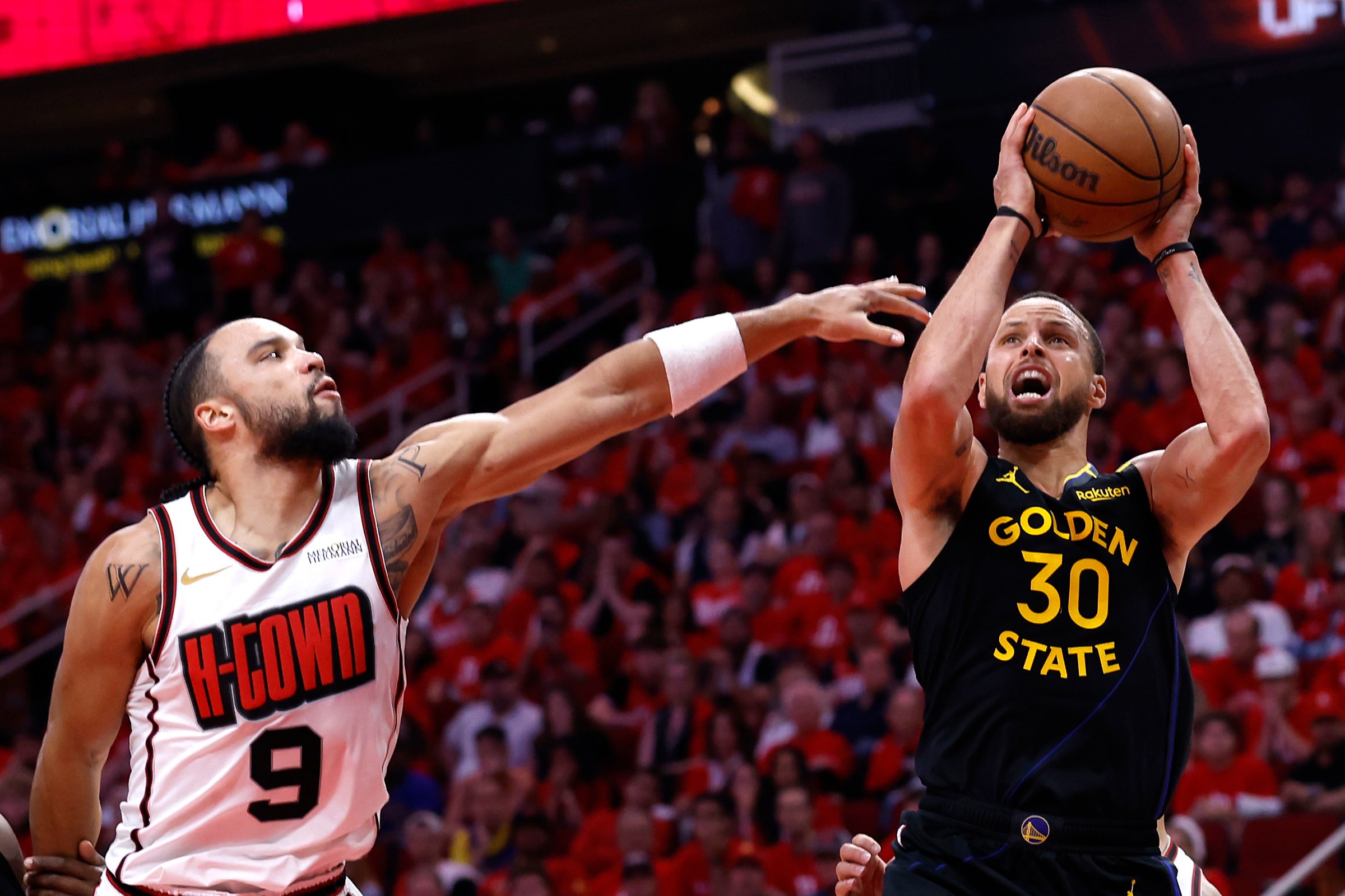 HOUSTON, TEXAS - MAY 04: Stephen Curry #30 of the Golden State Warriors shoots the ball against Dillon Brooks #9 of the Houston Rockets during the fourth quarter in Game Seven of the Western Conference First Round NBA Playoffs at Toyota Center on May 04, 2025 in Houston, Texas. NOTE TO USER: User expressly acknowledges and agrees that, by downloading and or using this photograph, User is consenting to the terms and conditions of the Getty Images License Agreement. (Photo by Tim Warner/Getty Images)