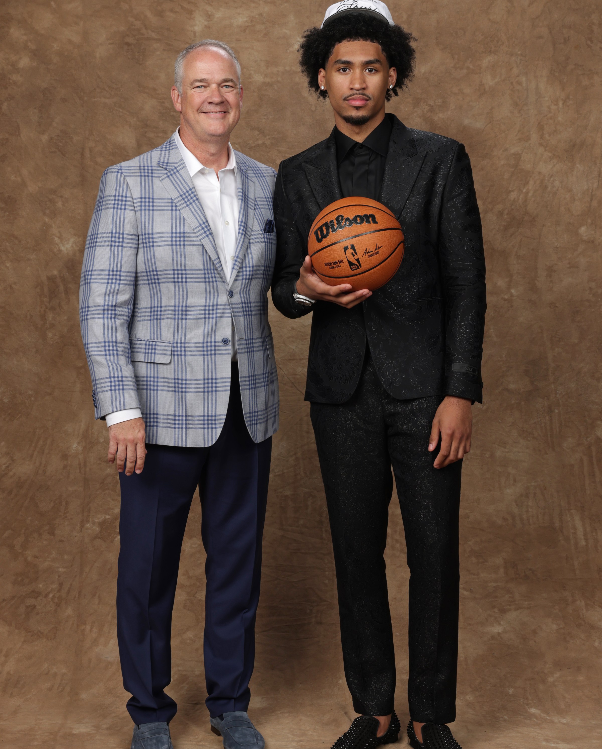 BROOKLYN, NY - JUNE 25: Dylan Harper poses for a photo with Steve Pikiell after being drafted by the San Antonio Spurs and the Utah Jazz during the 2025 NBA Draft - Round One on June 25, 2025 at Barclays Center in Brooklyn, New York. NOTE TO USER: User expressly acknowledges and agrees that, by downloading and or using this photograph, User is consenting to the terms and conditions of the Getty Images License Agreement. Mandatory Copyright Notice: Copyright 2025 NBAE (Photo by Steve Freeman/NBAE via Getty Images)