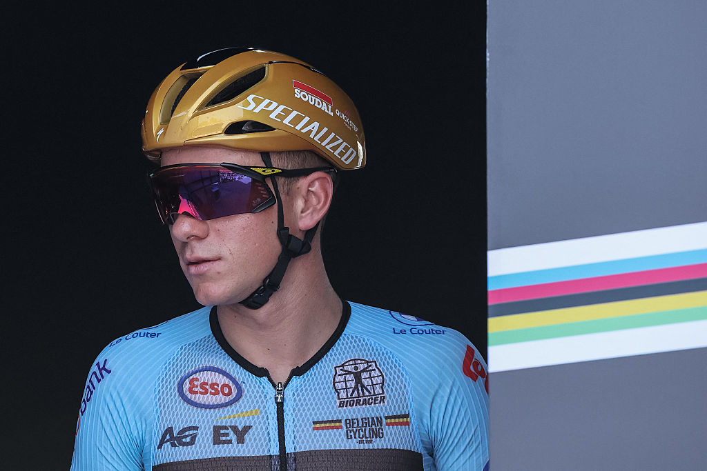 Belgian rider Remco Evenepoel reacts on the signature podium ahead of the men's Elite road race cycling event during the UCI 2025 Road World Championships, in Kigali, on September 28, 2025. (Photo by Anne-Christine POUJOULAT / AFP)