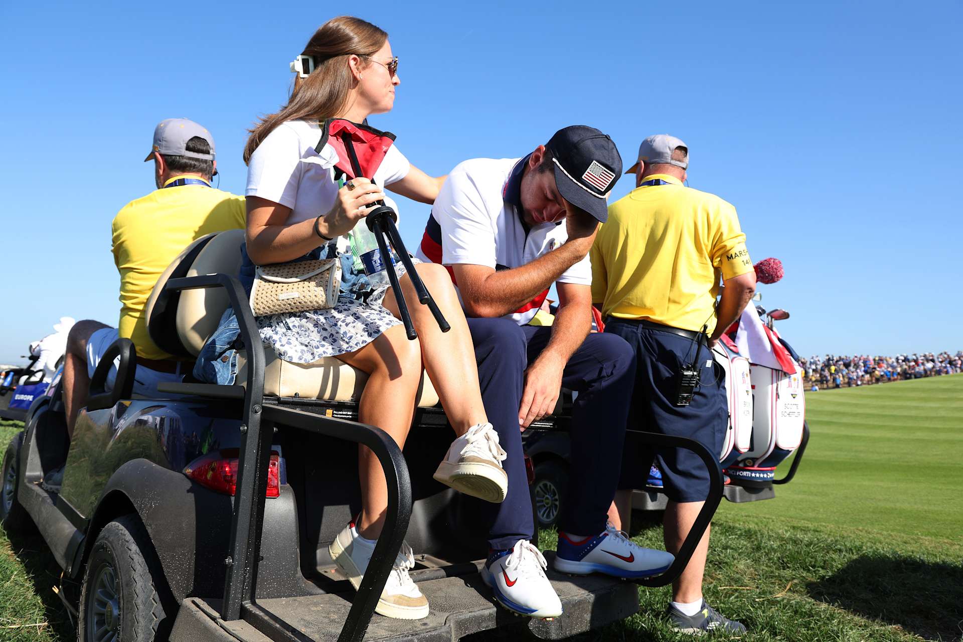 ROME, ITALY - SEPTEMBER 30: Scottie Scheffler of Team United States is consoled by his Wife, Meredith Scheffler after losing his match to Viktor Hovland and Ludvig Aberg of Team Europe 9&7 during the Saturday morning foursomes matches of the 2023 Ryder Cup at Marco Simone Golf Club on September 30, 2023 in Rome, Italy. (Photo by Jamie Squire/Getty Images)