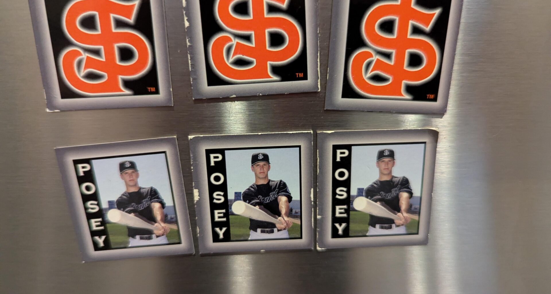 My hubs found these cleaning his home office. A giveaway in either the '08 or '09 season when Buster played for the San Jose Giants. We saw MadBum play during the '09 season too. Good times!