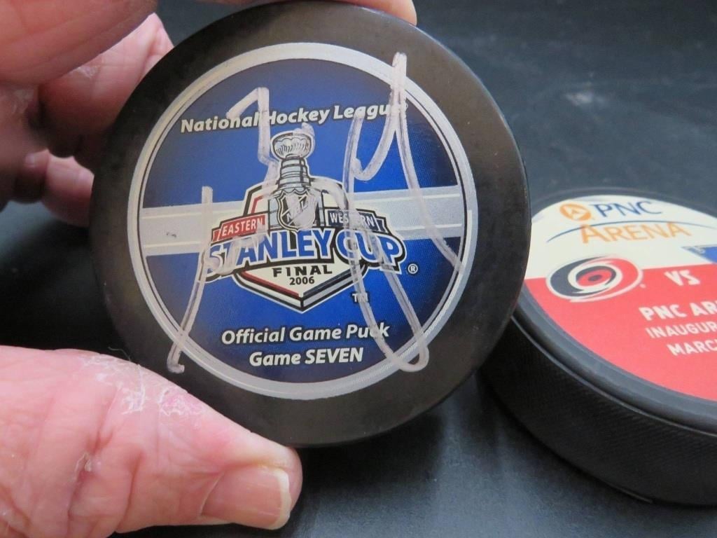 What about this one? 2006 Game 7 puck, I have no clue...