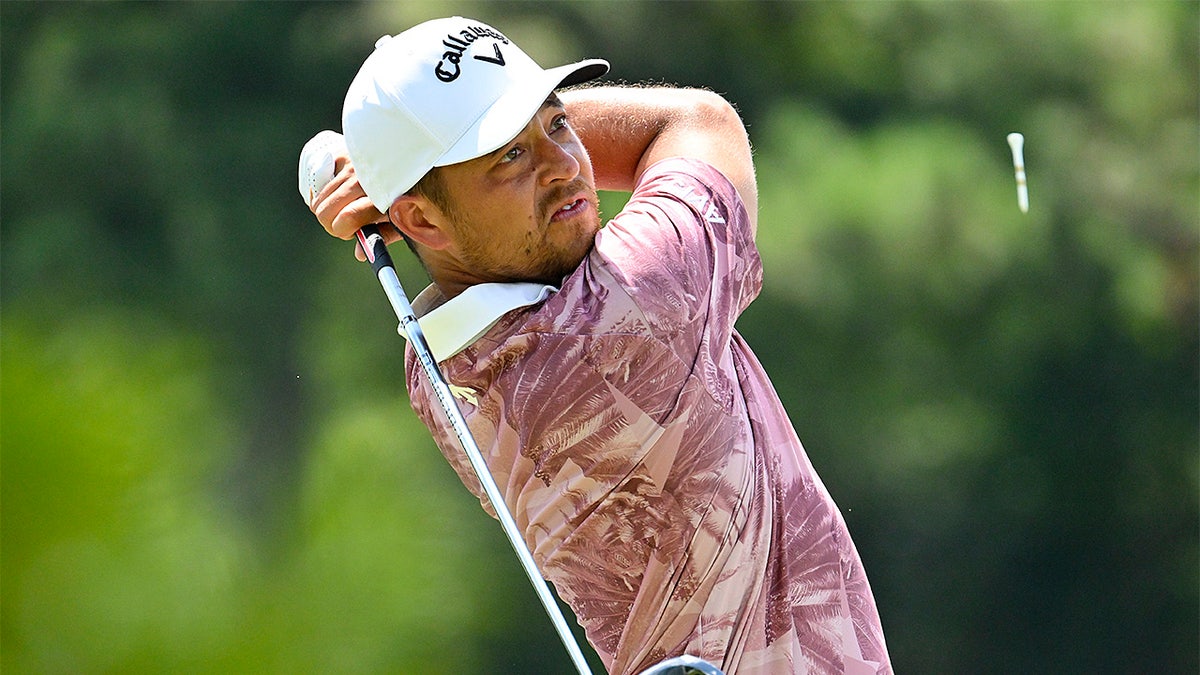 Xander Schauffele looks on