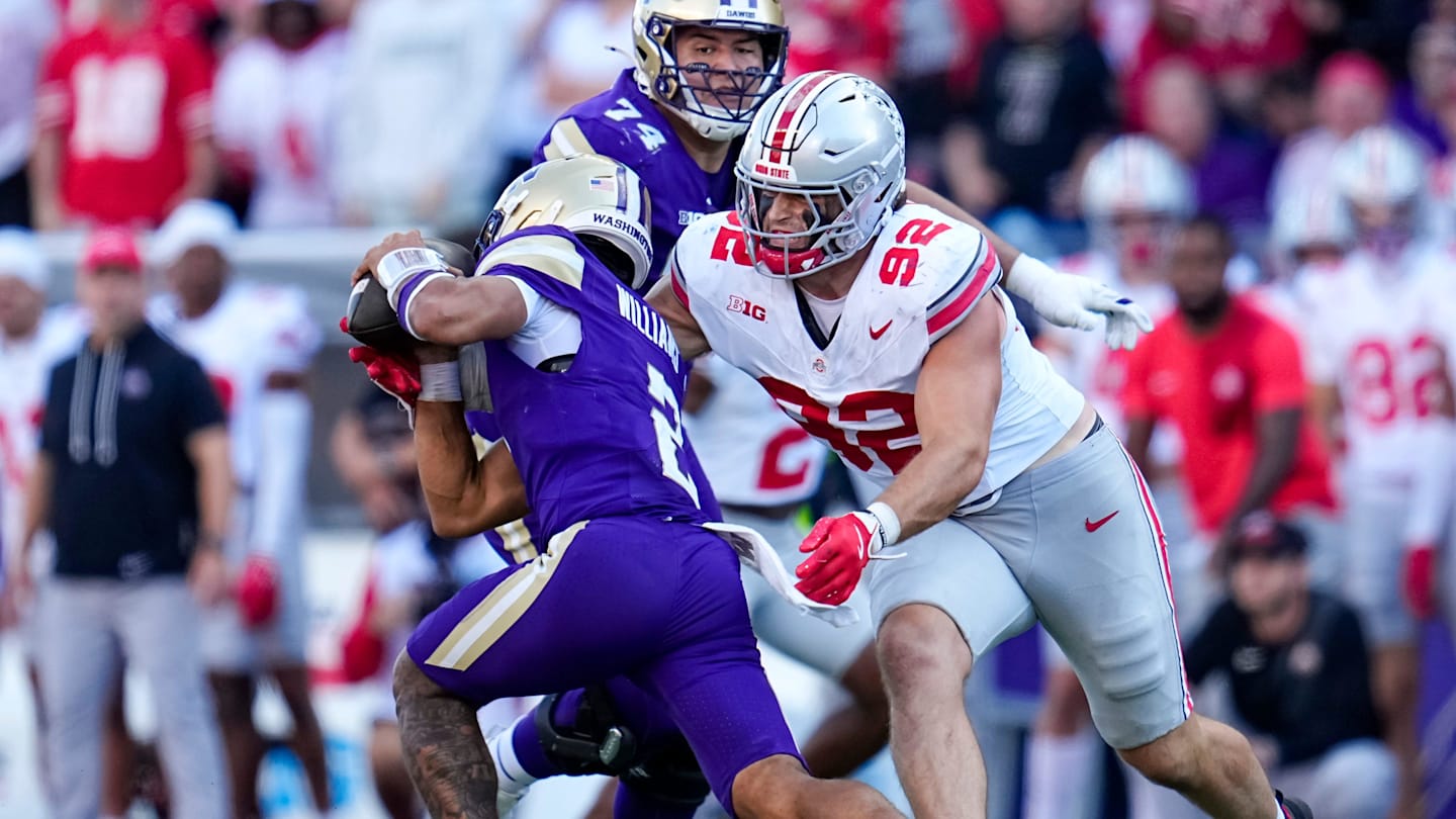 Ohio State Buckeyes defensive end Caden Curry (92) sacks Washington Huskies quarterback Demond Williams Jr. (2) during the second half of the NCAA football game at Husky Stadium in Seattle on Sept. 27, 2025. Ohio State won 24-6.