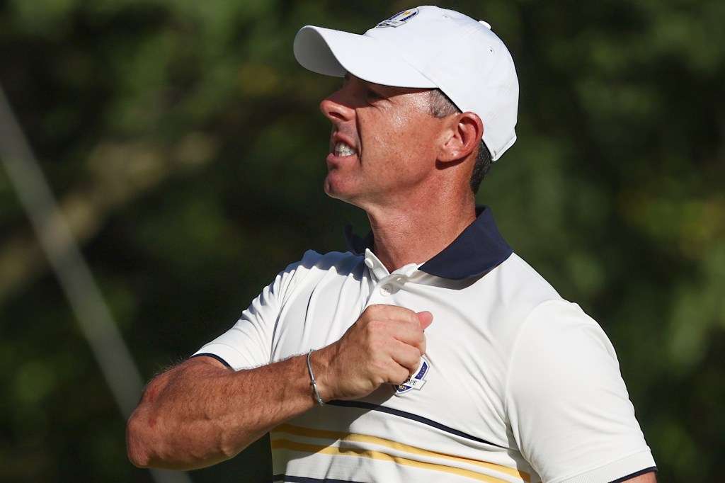 Rory McIlroy celebrates on the 15th hole during his singles match against Scottie Scheffler during the Ryder Cup at Bethpage Black Golf Course in Farmingdale, N.Y. on Sunday, Sept. 28, 2025.
