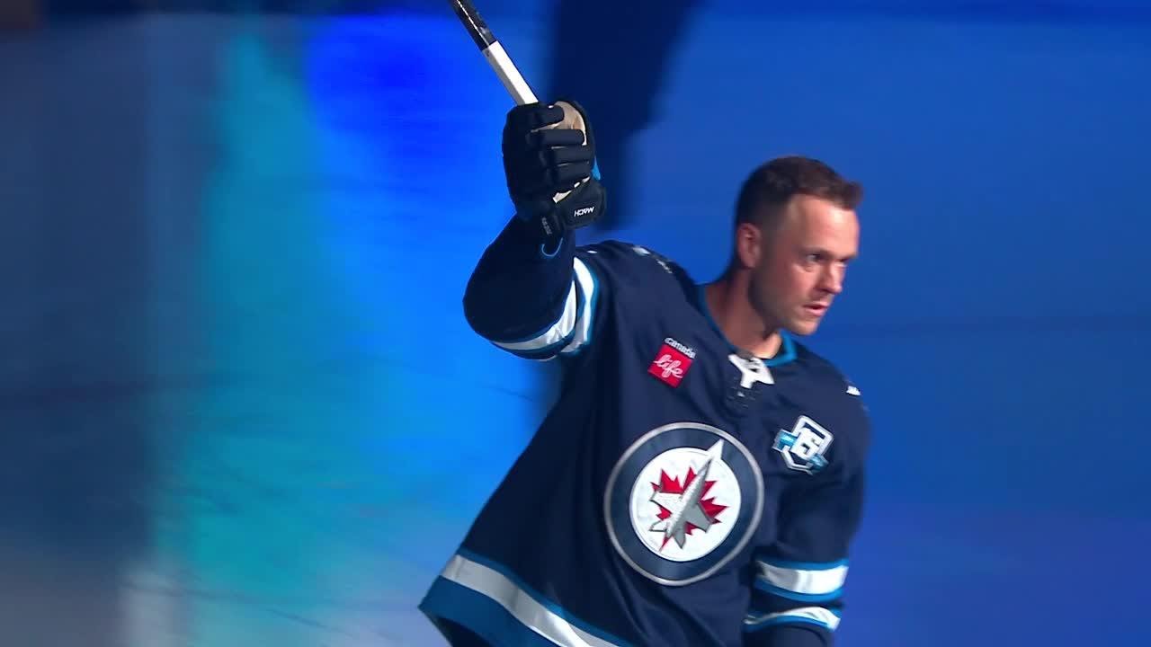 Jonathan Toews skates out as a Winnipeg Jet at the Home Opener!