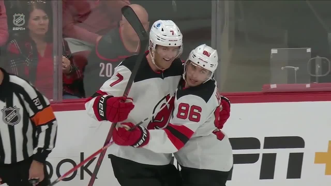Dougie Hamilton scores a goal against the Carolina Hurricanes