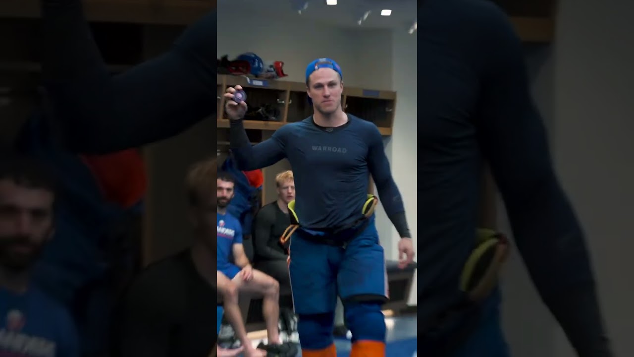 New York Islanders Captain Anders Lee Gives Game Puck To General Manager Mathieu Darche