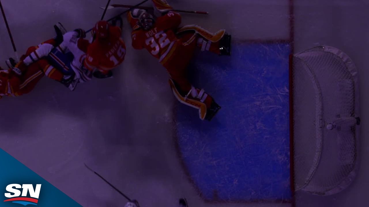 Flames' Dustin Wolf Makes A Great Save While In The Dark