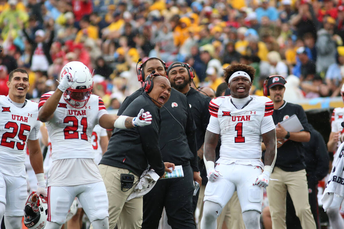 Utah players react during the second half of an NCAA college football game against West Virgini ...