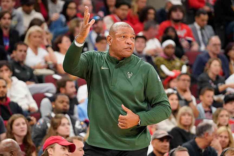 Milwaukee Bucks head coach Doc Rivers gestures to his during the first half of a preseason NBA basketball game against the Chicago Bulls, Sunday, Oct. 12, 2025, in Chicago. (AP Photo/David Banks)