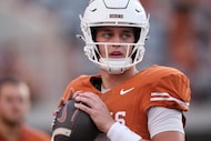 Texas quarterback Arch Manning (16) throws before an NCAA college football game against Sam...