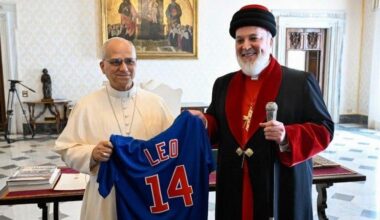 Pope Leo XIV receives a Cubs jersey from Mar Awa III