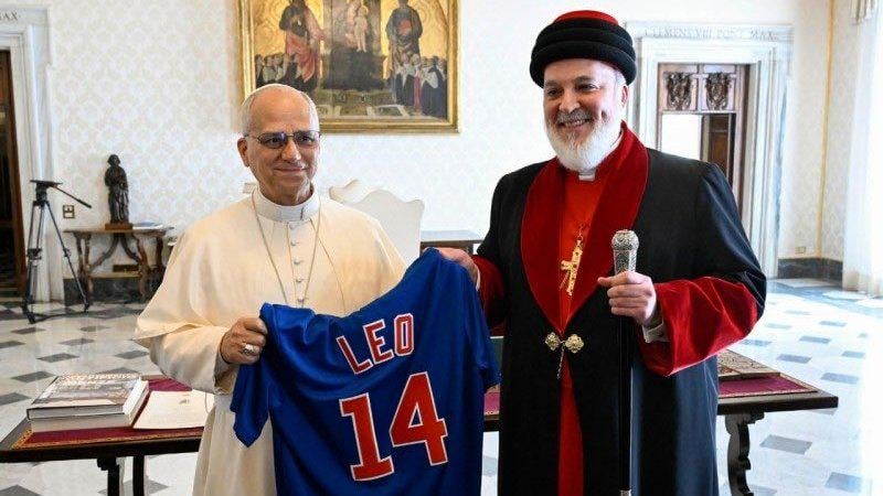 Pope Leo XIV receives a Cubs jersey from Mar Awa III