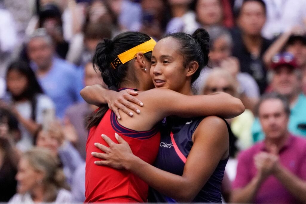 Emma Raducanu (L) hugs Canada's Leylah Fernandez after winning their 2021 US Open Tennis tournament women's final match at the USTA Billie Jean King National Tennis Center in New York.