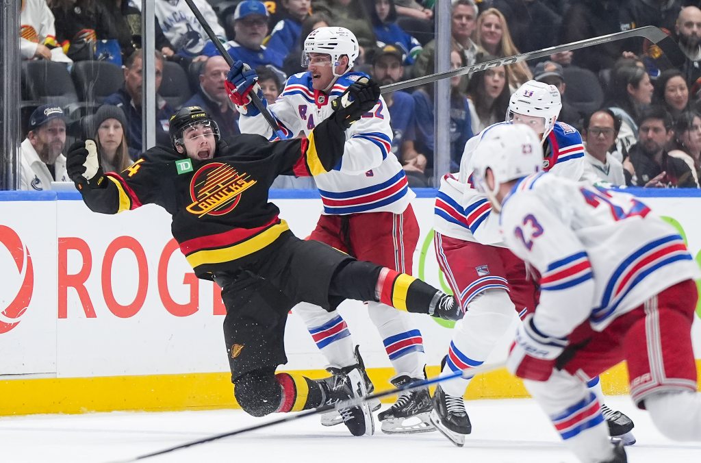 Jonny Brodzinski checks Linus Karlsson during the third period of the Rangers' 2-0 win over the Canucks on Oct. 28, 2025.
