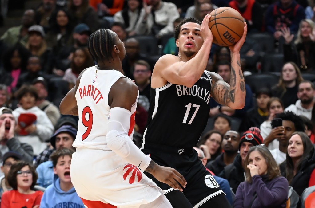 Michael Porter Jr., who scored a game-high 34 point, looks to make a move on RJ Barrett during the Nets' 119-114 loss to the Raptors in their preseason finale on Oct. 17, 2025.