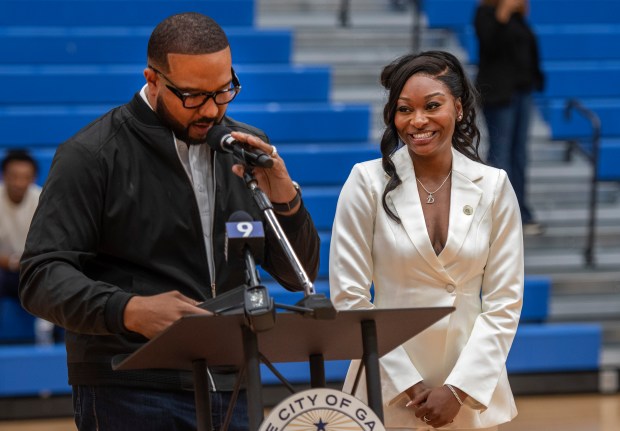 Gary Mayor Eddie Melton, left, honors WNBA star and Gary native Dana Evans with the Key to the City at West Side Leadership Academy in Gary on Thursday, Oct. 30, 2025. (Michael Gard/for the Post-Tribune)