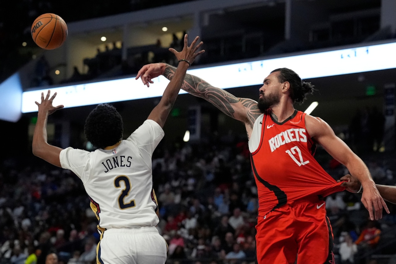 New Orleans guard Herb Jones and Houston Rockets center Steven Adams battle for a loose ball during an NBA preseason game on Tuesday, Oct. 14, 2025, at Legacy Arena at BJCC in Birmingham.