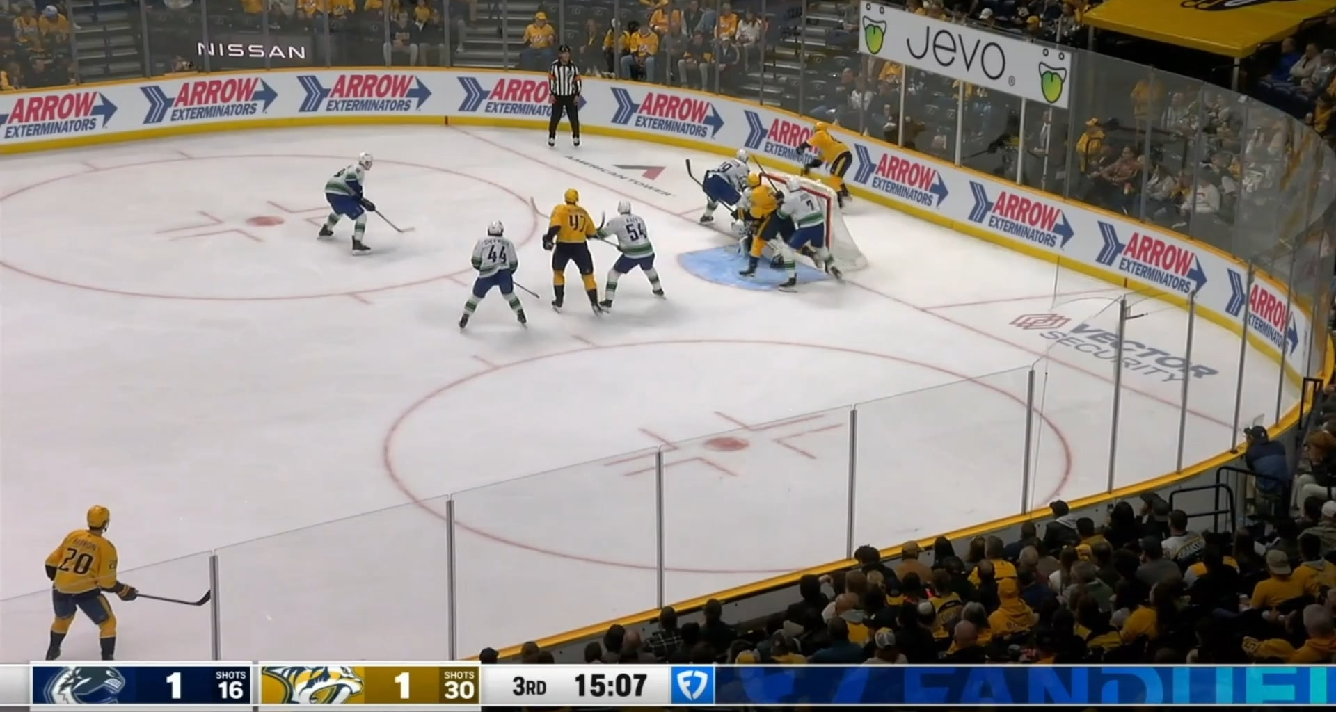 Cole Smith gets his stick on the puck and it trickles past Demko