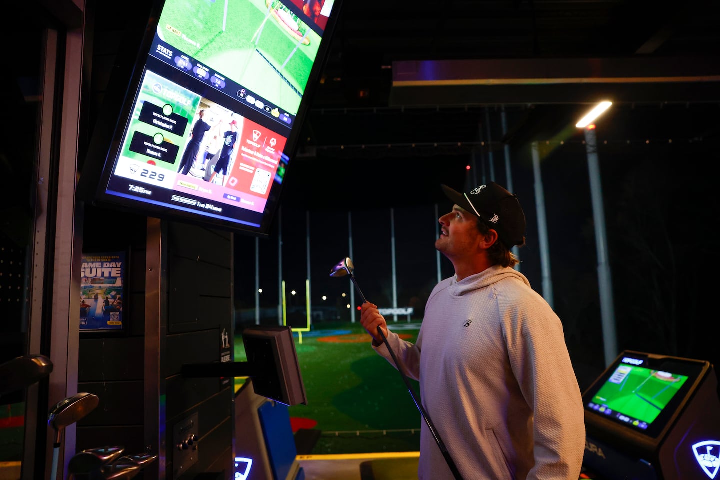 Patriots punter Bryce Baringer checked on his score at Topgolf in Canton.